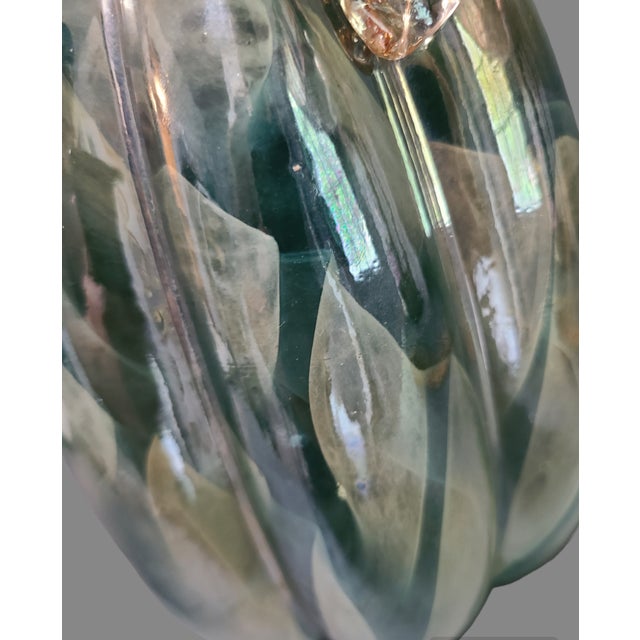 Add a touch of modern elegance to your home decor with this stunning art glass Pumpkin shaped decorative ornament. Crafted...