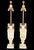 An elegant Pair of Neoclassical Style Alabaster Table Lamps, masterfully carved in a classical urn form and elevated by...