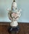 Large Capodimonte style porcelain cherub table lamp. Beautifully painted lamp with ornate metal dolphin footed stand. 31"...