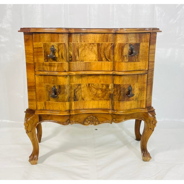 A finely crafted Italian two-drawer chest, designed and manufactured in Italy, showcasing the elegance and warmth of...