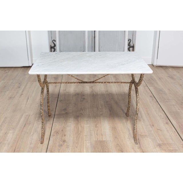 This elegant 19th-century French bistro table combines timeless design with functional sophistication. Featuring a...