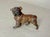 This antique miniature cold painted solid lead figurine is a collectible item depicting a Bulldog. The detailed...