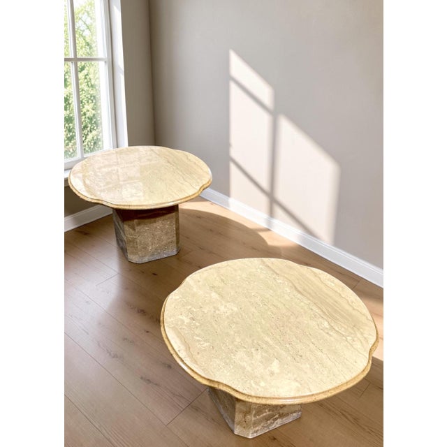 Italian travertine is shaped into soft undulating contours and an organic, cloud-like form in these 1970s scalloped-edge...
