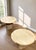 Italian travertine is shaped into soft undulating contours and an organic, cloud-like form in these 1970s scalloped-edge...