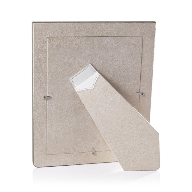 A sophisticated two-tone leather photo frame designed to showcase memories with style. Crafted from genuine Nappa leather,...