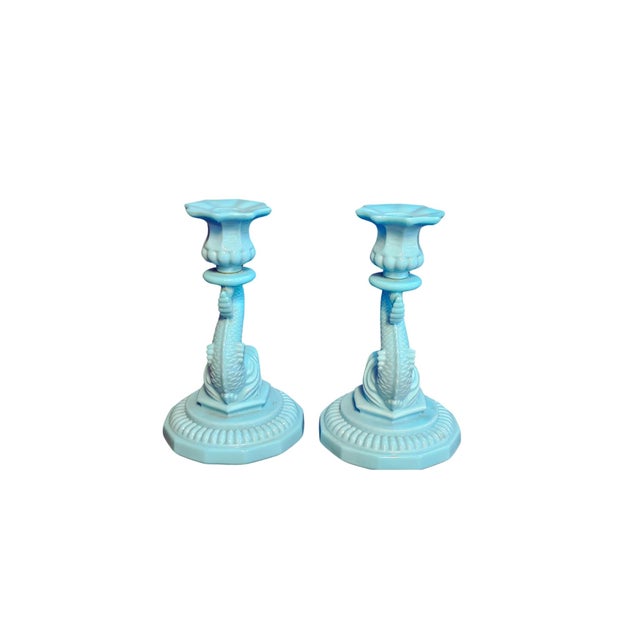 Elevate your home décor with this stunning set of two turquoise blue candlestick holders. Their vibrant hue brings warmth...