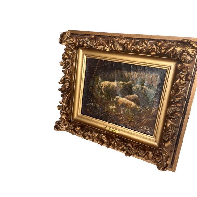 A charming antique oil on canvas titled Barnyard, depicting sheep within a wooded pastoral landscape. The composition...
