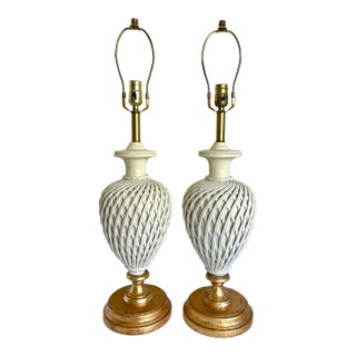 Mid 20th Century Hollywood Regency White Porcelain Lattice Urn Lamps With Gilt Bases - a Pair For Sale