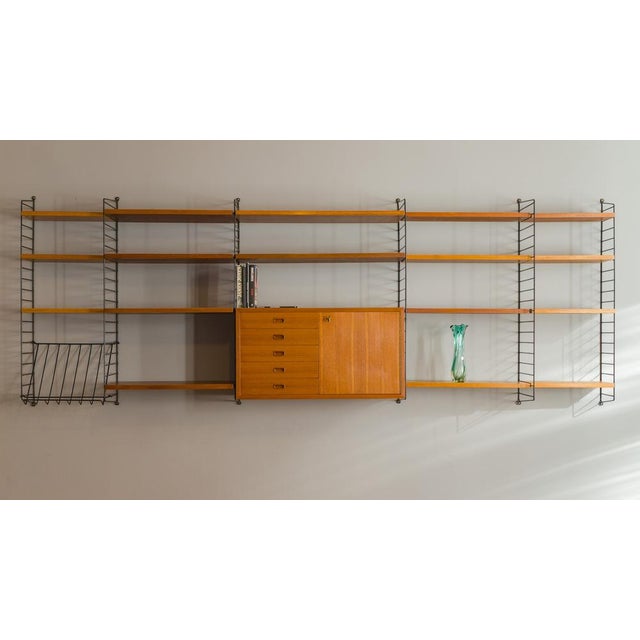 The bookcase is in very good condition, the shelves have been refreshed. Visible traces of use and a sign of time....