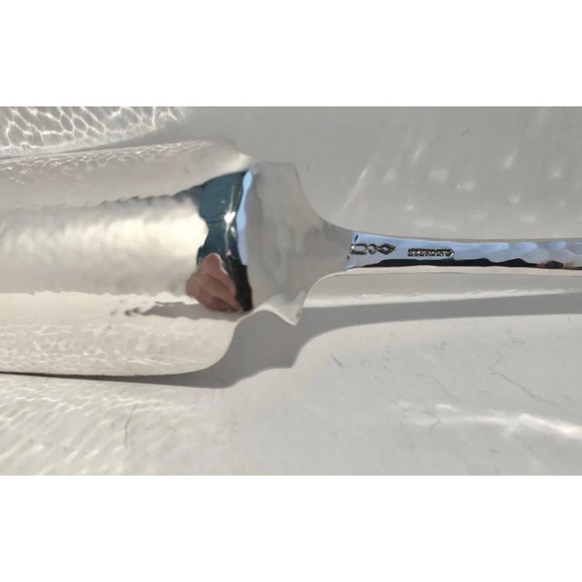 Sterling silver stilton cheese scoop by Dominick & Haff in the "Old English Antique Pattern-Hammered". Deeply incised...