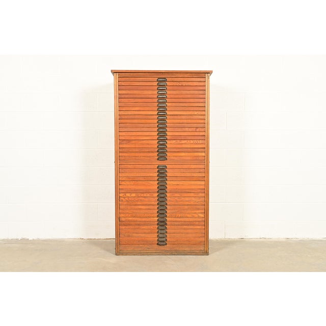 A rare and exceptional antique Arts & Crafts 40-drawer architect's blueprint flat file cabinet, map file, or printer's...