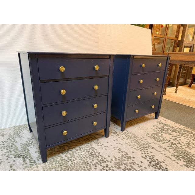 Design Plus Gallery presents a Pair of Navy Sidney Nightstands from Ballard Designs. The nightstands each have four equal...