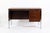 This vintage mid-century modern rosewood writing desk was designed by Jean Gillon for Italma Wood Art and made in Brazil...