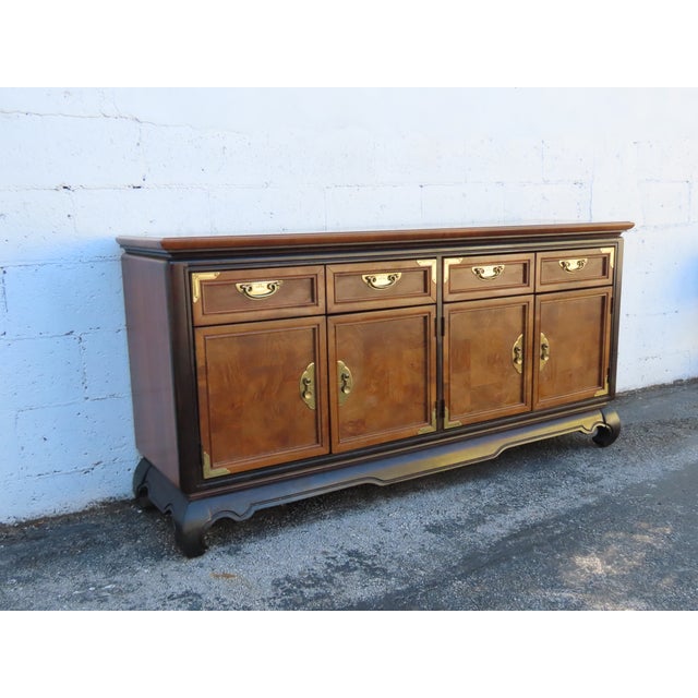 This magnificent Sideboard is made of wood, solid wood, veneer, and metal. The Sideboard was made by a fine furniture...