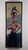 The artwork depicts a striking moment of balance and trust between two figures, with a strong male figure supporting a...