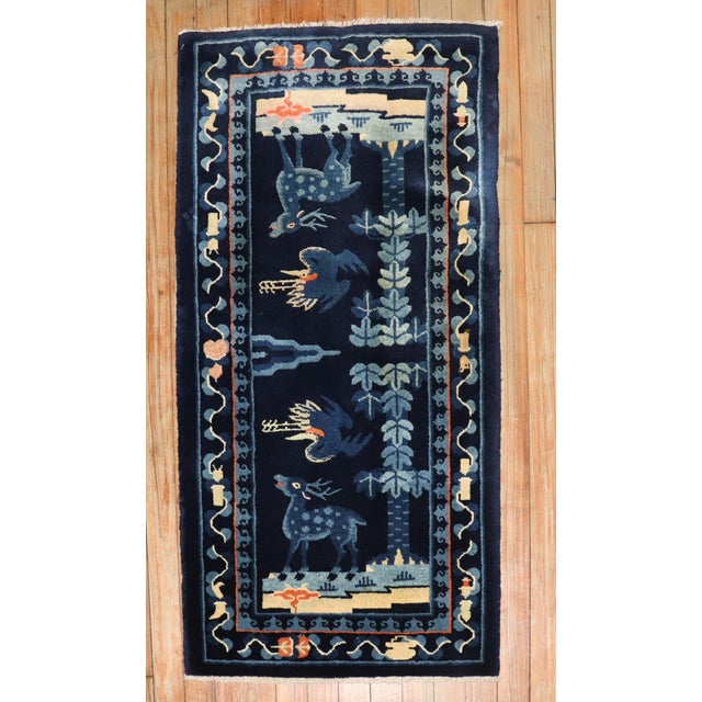 Scatter size Chinese Peking rug from the 2nd quarter of the 20th century with an animal pictorial motif Measures: 1'11" x...