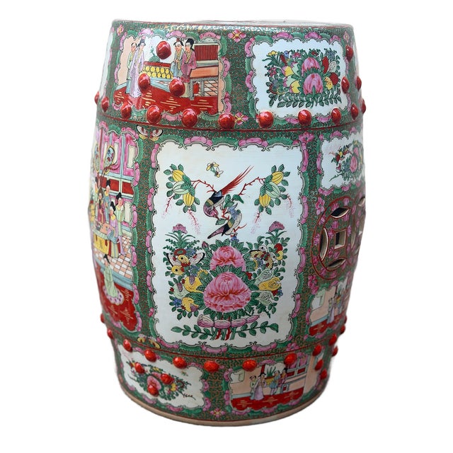 This is a vintage mid century Chinese porcelain garden stool crafted in Macau in a richly detailed famille rose palette....