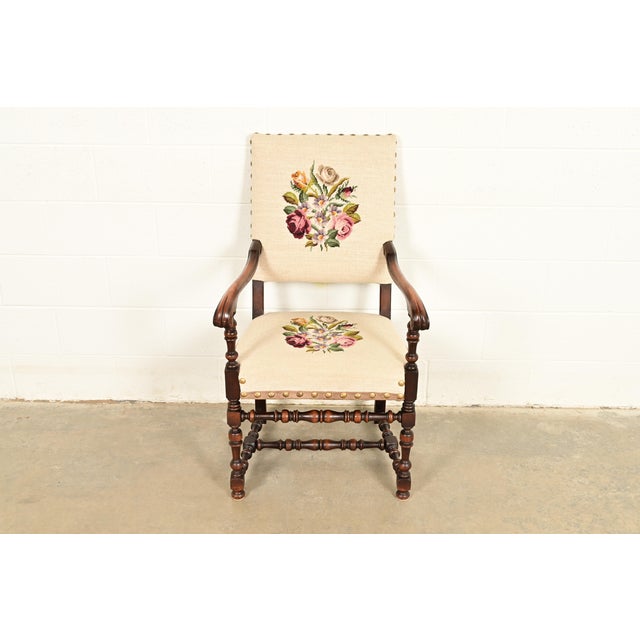 A beautiful antique English Jacobean or Tudor style armchair, club chair, or library chair In the manner of Berkey & Gay...