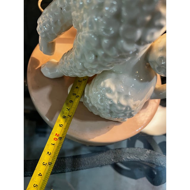 Up for consideration is a beautiful vintage pair of pink ceramic poodle table lamps. These would look lovely in your home,...