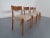 Teak dining chairs with wool fabric from the 1960s.