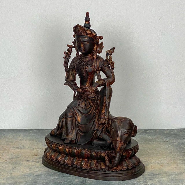 A very large Chinese casting of a Bodhisatva seated on a elephant, circa 1980,