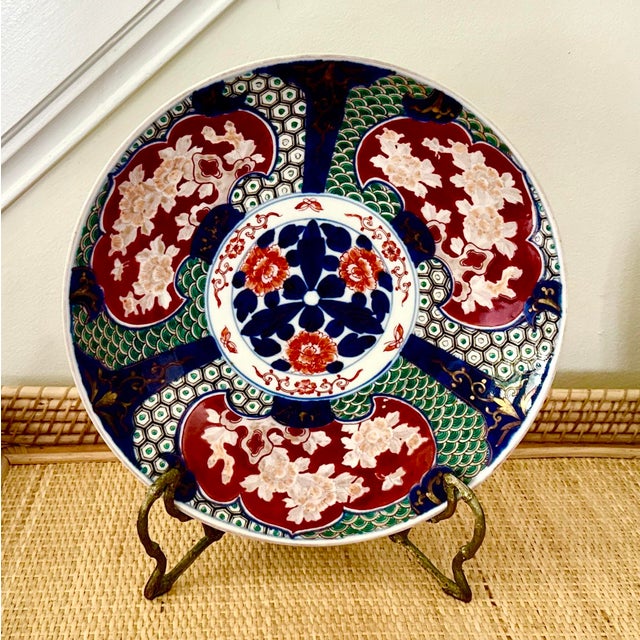 This striking vintage Japanese Imari charger features bold hand‑painted florals, deep cobalt panels, and richly patterned...