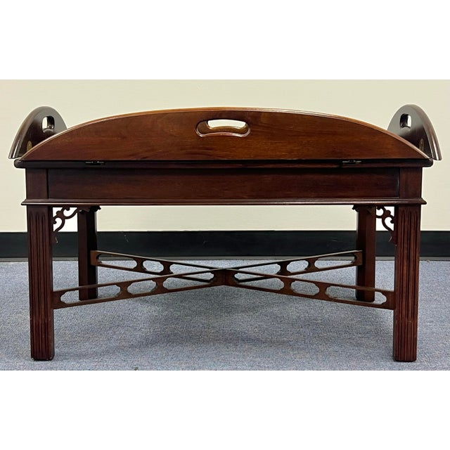 Chinese Chippendale mahogany butters tray coffee table by Knob Creek. Classic design featuring drop down sides converting...