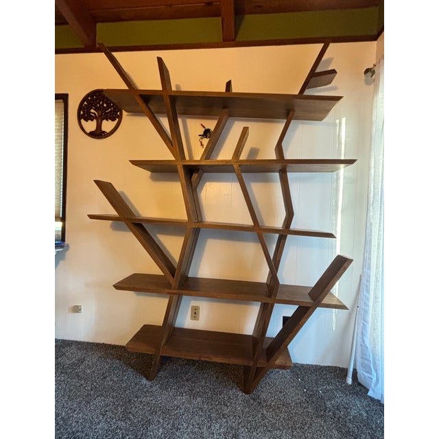Handmade in Thailand, this stunning teak wood bookshelf is as whimsical as it is functional. Crafted to flow like the...