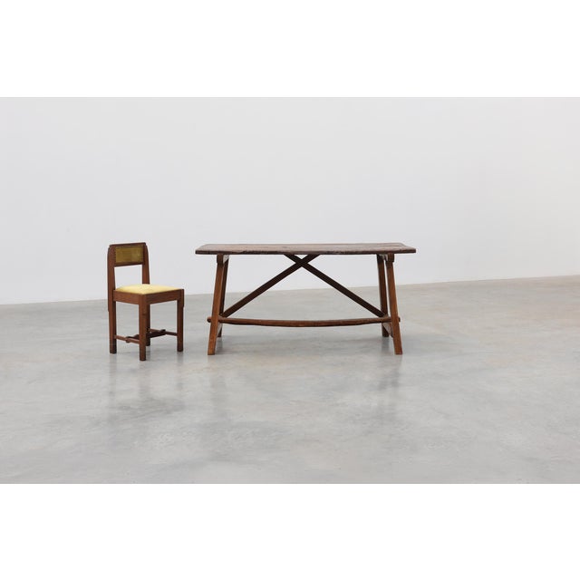 A characterful Spanish rustic trestle table dating from the 19th century, distinguished by its honest craftsmanship,...