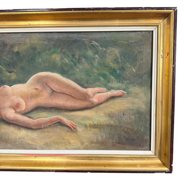An elegant antique oil painting depicting a reclining female nude, dating from the early 20th century. Executed in oil on...