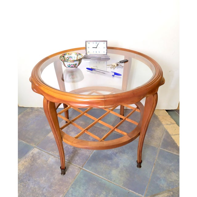 This round coffee table Is attributed to Paolo Buffa for form and style. No logo. This piece is attributed to the...