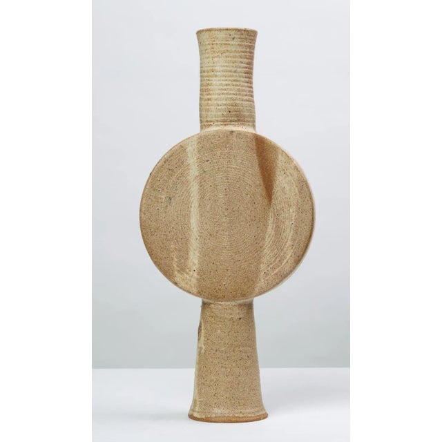 A stunning centrepiece Studio Pottery vase with several openings. The columnar piece has a central circular body with an...