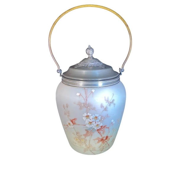 An antique Mt. Washington milkglass biscuit (or cracker jar) with the original lid. The beautiful pastel florals are on...