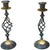 Striking midcentury pair of candleholders meticulously handcrafted of solid brass and metal. Featuring ornate playful...