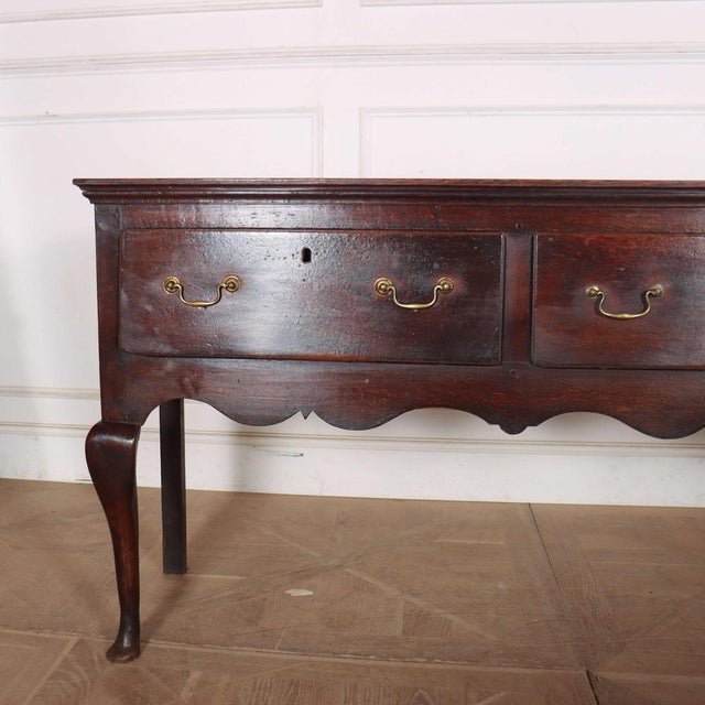 Very good 18th Century English oak 3 drawer dresser base. Excellent colour. 1760 This piece is designed in the style of...