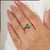 Crafted in 925 sterling silver, this elegant ring features a 6×8 mm octagon-cut natural emerald weighing 1.6 carats. Its...