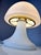 This table lamp from Glashütte Limburg is an iconic design object from the Space Age era. Its characteristic mushroom...