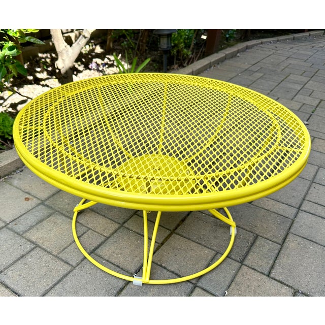 This rare Homecrest patio coffee table has a unique Lazy Susan feature. Its wrought iron , diamond-grid top spins on...