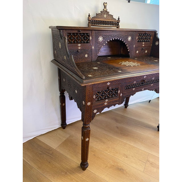 Very fine antique Moorish style inlaid writing desk and chair set, circa 1920's. This hand-carved, intricately detailed...