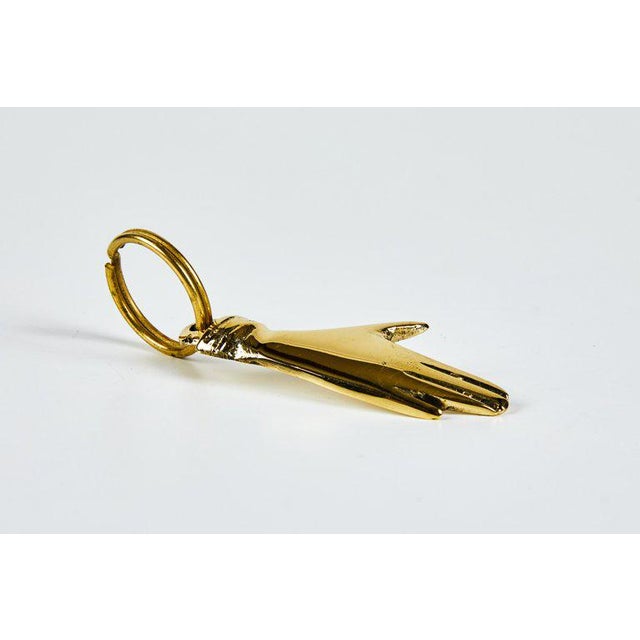 Carl Auböck model #5734 'Hand' brass figurine keyring. Designed in the 1950s, this incredibly refined and sculptural...