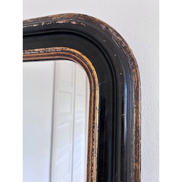 Antique French Louis Philippe small full-length mirror, dating to the late 19th century. The mercury glass mirror features...