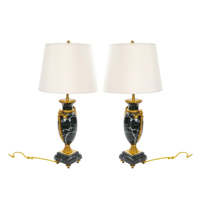 An exceptional pair of antique French table lamps, crafted in France during the mid to late 19th century and showcasing...