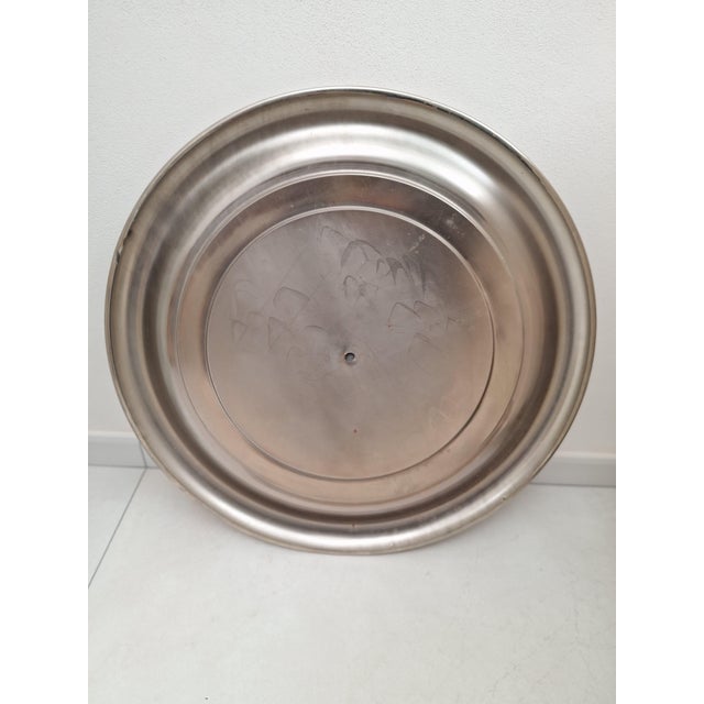 Round mirror in satin-finish steel, produced in the 1960s and 1970s, designed by Sergio Mazza. Good overall condition. As...