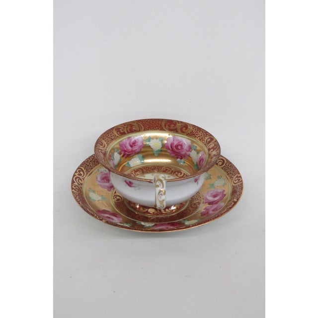 This lovely tea cup is made of bone china. This set is stamped as being made by Mogi Momonoi, a Japanese exporter with...