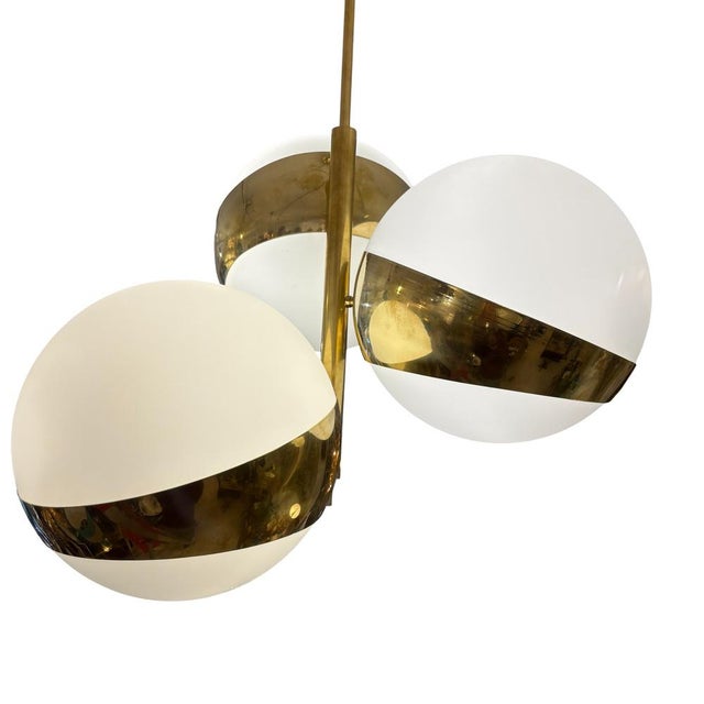 The "Nido" lamp by Stilnovo, an Italian design featuring three globes from the 1970s. Its metal structure consists of...