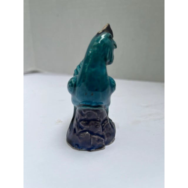 A single small antique Chinese export porcelain model of a chicken or rooster. Finished with traditional purple and green...