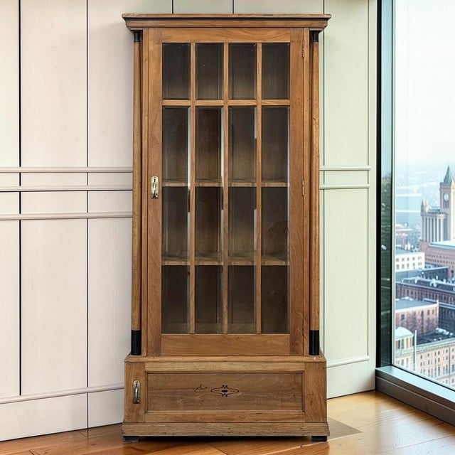 Graceful proportions, exceptional craftsmanship, and timeless neoclassical design make this Dutch solid oak display...