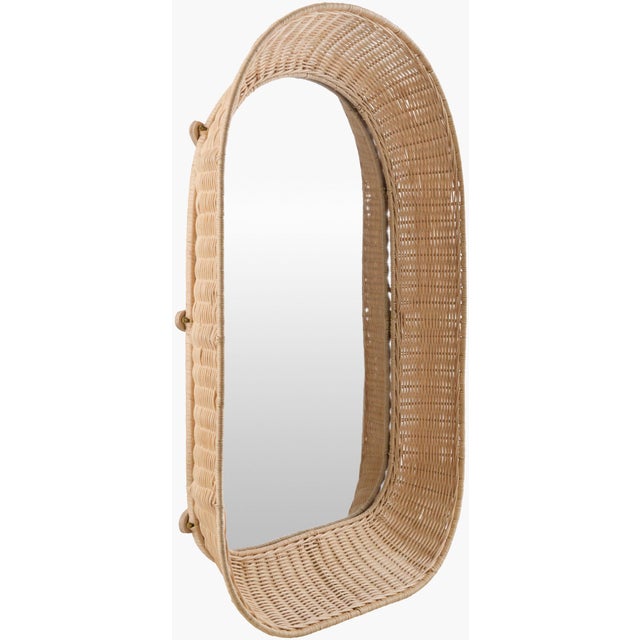 Elevate your living space with the Castine accent mirror, a stunning piece of Bohemian Global style wall decor that will...