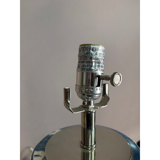 No longer available in retail -- Limited edition. Cross hatch blue and white Table Lamp with silver accents and clear base