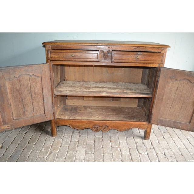 19th century French oak maid's cupboard, chest of drawers, dresser. The height is 120 cm. The width is 136 cm. The depth...